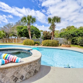Spend the afternoon drifting between the pool and spa under bright coastal skies.