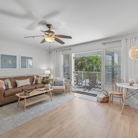 Your bright, open living space features coastal charm with leather seating, natural textures, and tropical views from your private balcony.