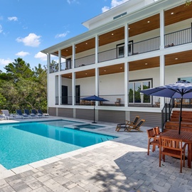 Massive pool with splash pad and attached spa/hot tub.