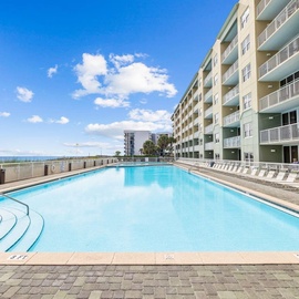 Beachfront property with sparkling pool deck and Gulf views, steps from the sand.