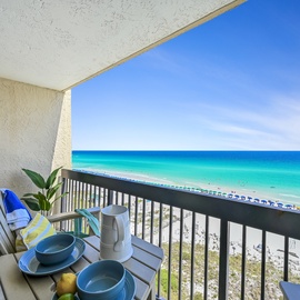 Sip your morning coffee on this beachfront balcony while watching turquoise waves meet pristine white sand.