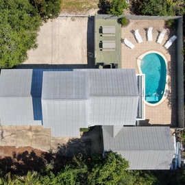 Relax in your own outdoor haven, complete with a pool and thoughtfully designed lounge areas.