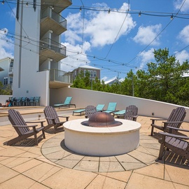 Gather around the rooftop fire pit for memorable evenings under twinkling lights, with comfortable seating for your entire group.