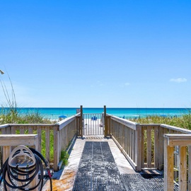 Your private boardwalk leads straight to pristine turquoise waters and sugar-white sand for effortless beach access.