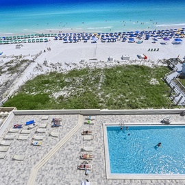 Beachfront paradise with pristine white sand, crystal-clear waters, and your own pool oasis just steps from the shore.