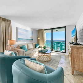 Unwind in a serene coastal living space where soft hues and sweeping ocean views create effortless elegance.