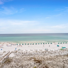 Stunning beachfront location with pristine white sand and crystal-clear Gulf waters just steps from the property.