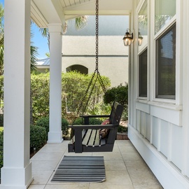 Relax on the front porch swing after a day at the beach!