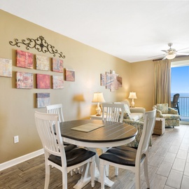 You'll love gathering around this stylish dining table while enjoying breathtaking ocean views through your private balcony doors.