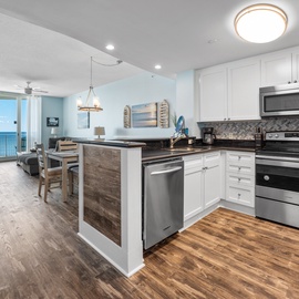 Your fully equipped kitchen opens to ocean views, perfect for morning coffee while watching waves roll in.