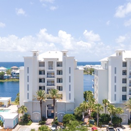 Modern beachfront resort buildings overlook pristine turquoise waters and tropical lagoons in this stunning Caribbean destination.