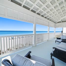 Sink into plush seating on your private covered balcony and watch endless azure waves meet pristine white sand.