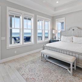 Wake up to stunning ocean views from your bed. The balcony doors invite you to step outside and breathe in the coastal breeze, while crisp linens and calming décor promise a restful retreat.