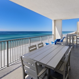 Stunning beachfront balcony offers breathtaking ocean panoramas and pristine white sand views from your private outdoor retreat.