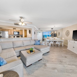 Sink into the plush sectional sofa and enjoy your spacious open-concept retreat with modern kitchen and ocean views.