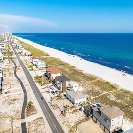 Stunning beachfront location with pristine white sand and crystal-clear Gulf waters stretching endlessly before this coastal community.