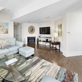 Your bright, open living space features comfortable seating and a cozy fireplace, perfect for relaxing after exploring the area.