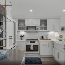 Your modern kitchen invites culinary adventures with gleaming white counters, stainless appliances, and thoughtful details that make cooking feel effortless and joyful.