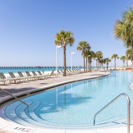 Dive into paradise at this stunning beachfront pool, where crystal-clear waters meet white sand beaches and swaying palms create your tropical escape.