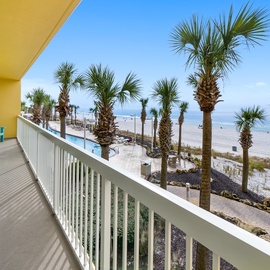 Step onto your private balcony and soak in stunning beach views framed by swaying palms and crystal-clear waters.