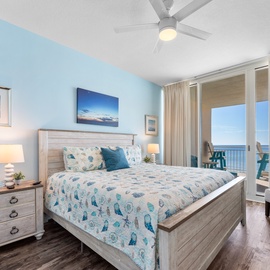 Wake up to soothing sea blues and stunning ocean views from your peaceful bedroom retreat with comfortable coastal furnishings.