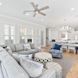 Relax in your spacious open-plan living space with plush sectional seating and modern kitchen flowing seamlessly together for perfect gatherings.