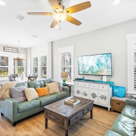 Sink into plush leather seating in your bright, airy living room where coastal breezes flow through and entertainment awaits on the large screen.