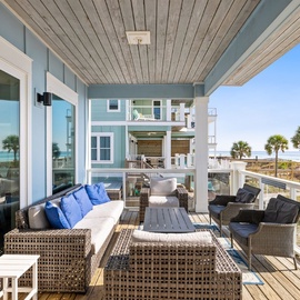 Relax on your private oceanfront balcony with plush seating and stunning views of pristine beaches and swaying palms.