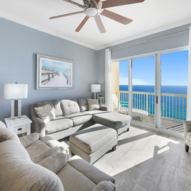 Relax in your coastal living room where plush seating and panoramic ocean views create the perfect seaside sanctuary.