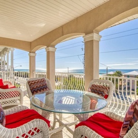 Your private covered balcony offers stunning ocean views with comfortable wicker seating for morning coffee or evening cocktails.
