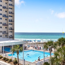 Beachfront resort with pristine white sand, turquoise waters, and sparkling pool just steps from your door.