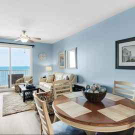Relax in your bright coastal living space with stunning sea views and comfortable seating for memorable vacation moments.