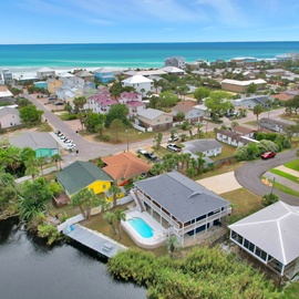 Coastal community featuring waterfront homes and beach access in a peaceful residential setting.