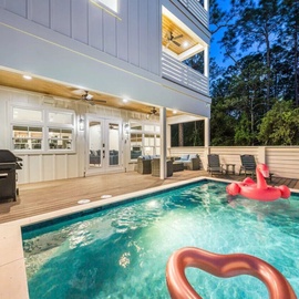 Dive into your private oasis with crystal-clear waters, covered deck seating, and BBQ ready for poolside dining adventures.