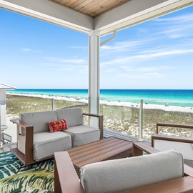 Stunning beachfront views frame your private terrace, where turquoise waters and soft white sand create the perfect backdrop for your morning coffee or sunset cocktail.