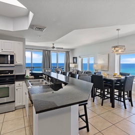 Your modern kitchen opens to stunning ocean views, where you'll cook with endless blue horizons as your backdrop through floor-to-ceiling windows.
