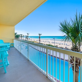Wake up to turquoise ocean views and tropical palms from your private balcony, complete with bright seating overlooking the pool.