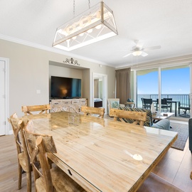 Your open-concept dining and living space features stunning ocean views, modern amenities, and coastal charm perfect for memorable gatherings.