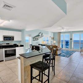 Your stunning oceanfront retreat features a fully-equipped kitchen and open living space where you can cook, dine, and relax with breathtaking sea views.