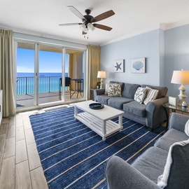 Relax in your coastal haven with ocean views and beach-inspired decor. The spacious living room opens to your private balcony overlooking endless blue waters.