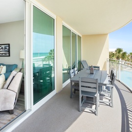 Step onto your private balcony where ocean views and poolside scenes create the perfect backdrop for morning coffee or evening relaxation.