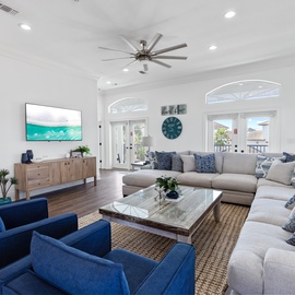 Sink into the spacious sectional sofa and enjoy movie nights on your large smart TV in this bright, airy living room.