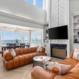 Sink into luxurious leather seating while you soak in stunning ocean views through panoramic windows—your perfect retreat awaits.