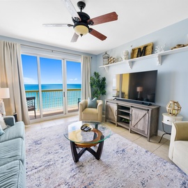 Unwind in your oceanfront living room where soft blues mirror the sea beyond your private balcony.
