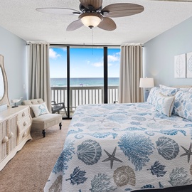 Wake up to stunning ocean views from your dreamy coastal bedroom, complete with beach-themed linens and private balcony access to paradise.