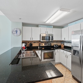 Your spacious kitchen features granite countertops, stainless steel appliances, and everything you need to create memorable vacation meals.