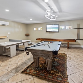 Your ultimate entertainment retreat awaits with billiards, shuffleboard, and comfortable seating—perfect for memorable evenings with friends and family.