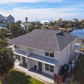 Waterfront vacation home offering direct canal access in a quiet coastal neighborhood with stunning water views.