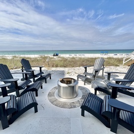 Gather around your private fire pit with oceanfront views, where evening conversations flow as naturally as the waves beyond.