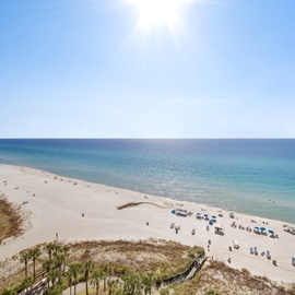 Stunning beachfront location with pristine white sand and crystal-clear turquoise waters stretching to the horizon.